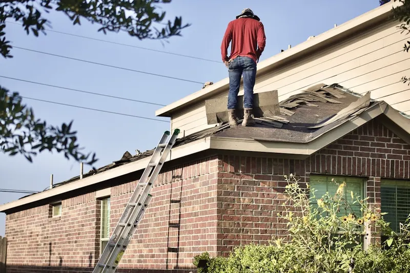Professional roofer working on a residential roof in Duarte